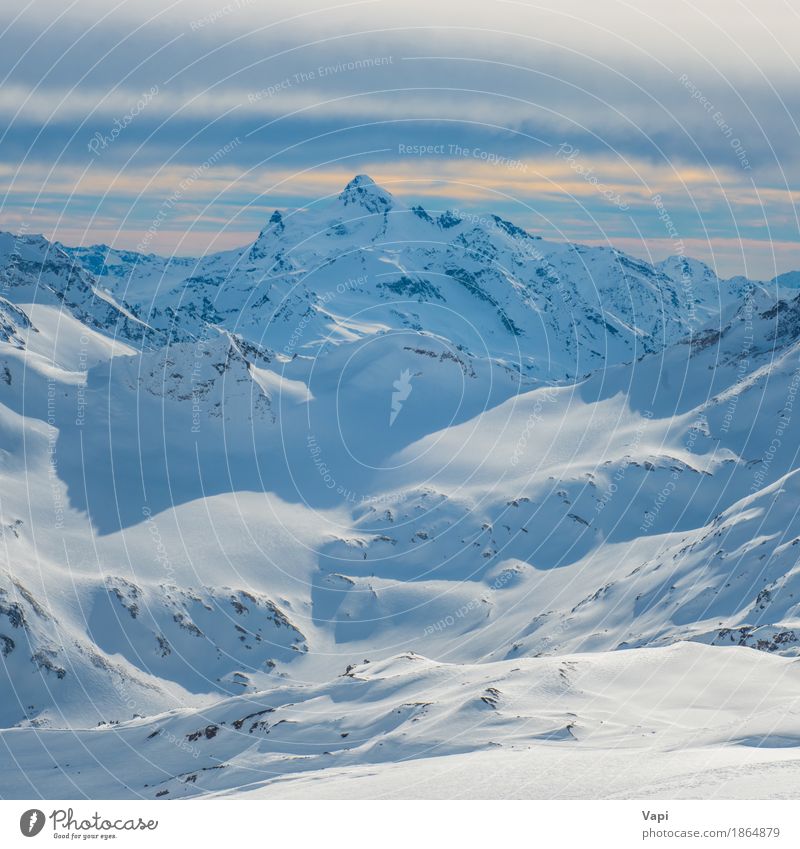 Snowy blue mountains in clouds at sunset Vacation & Travel Tourism Adventure Winter Winter vacation Mountain Climbing Mountaineering Skis Nature Landscape Sky