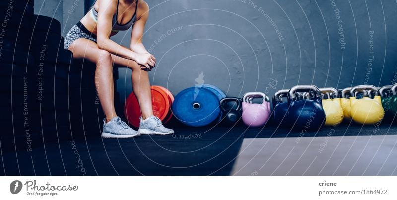 Detail of Girl resting sitting on weights in Gym Lifestyle Athletic Fitness Leisure and hobbies Sports Sports Training Human being Young man