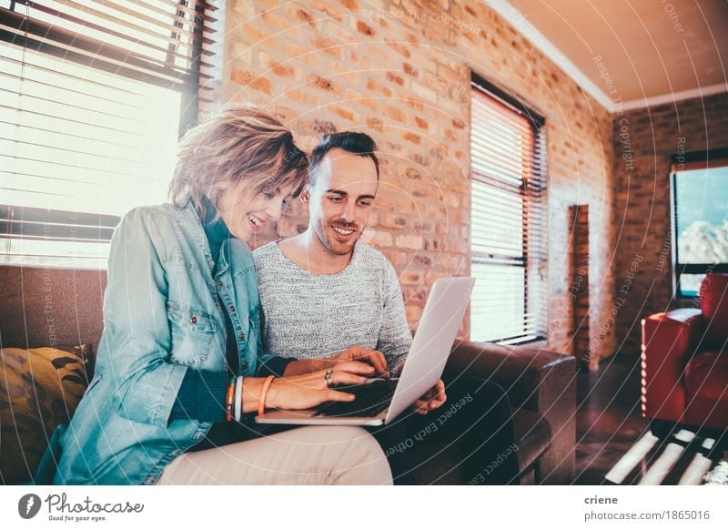 Mother and son browsing together on laptop Lifestyle Joy House (Residential Structure) Living room Office work Business Company Career Meeting Team Computer