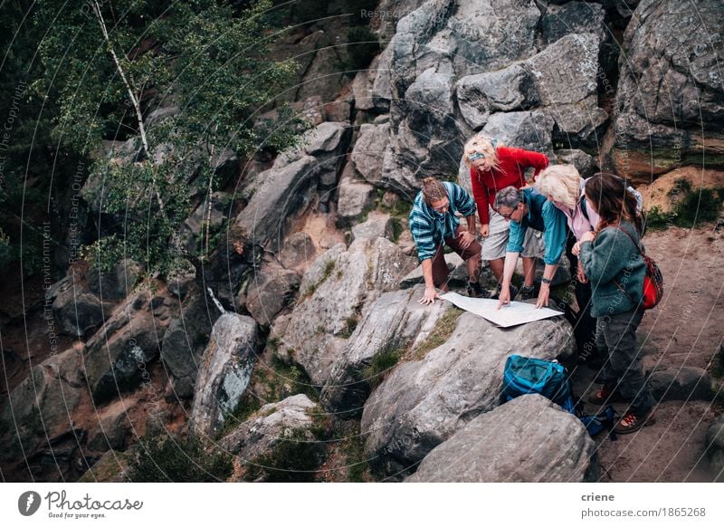 Group of mixed age people on hike checking trail on map Lifestyle Joy Leisure and hobbies Vacation & Travel Tourism Trip Adventure Camping Mountain Hiking