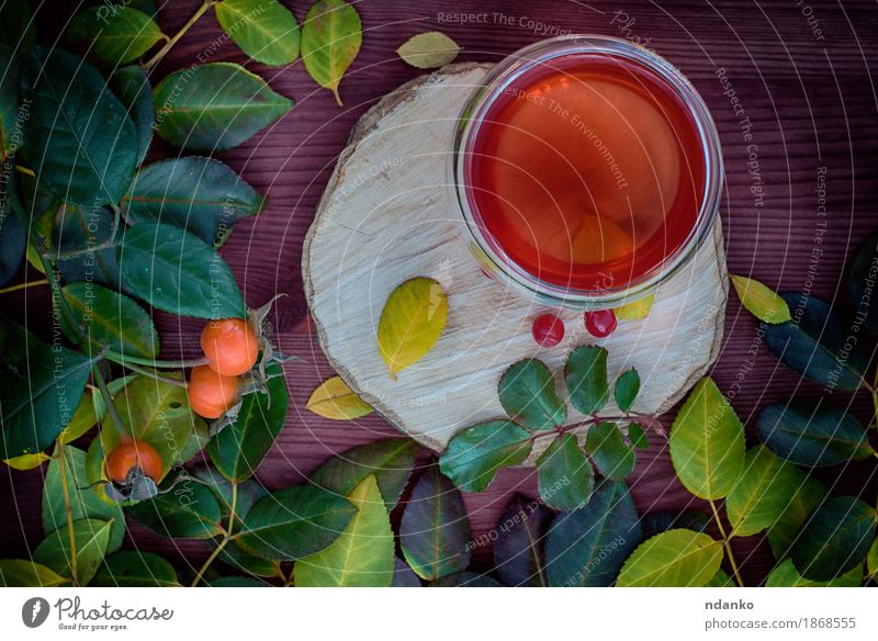 Tea with fruits on a wooden surface Fruit Tree Leaf Hot Natural Fallen drink Fragrant food Tasty healthy background herbal rowan rose hip stump cup glass