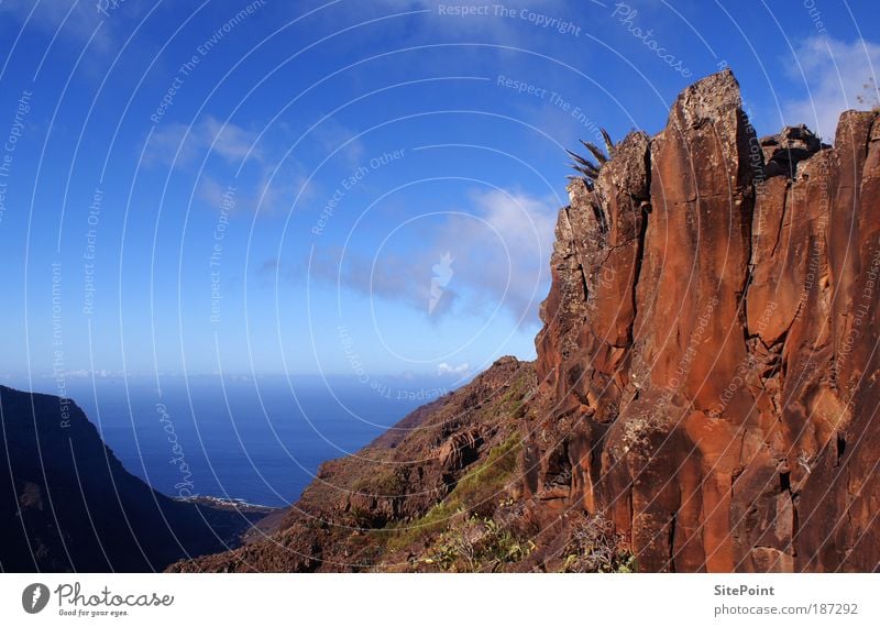 Like in the Wild West Landscape Sky Clouds Rock Mountain Ocean Island Stone Water Horizon Gomera Red Blue Far-off places Colour photo Exterior shot Twilight