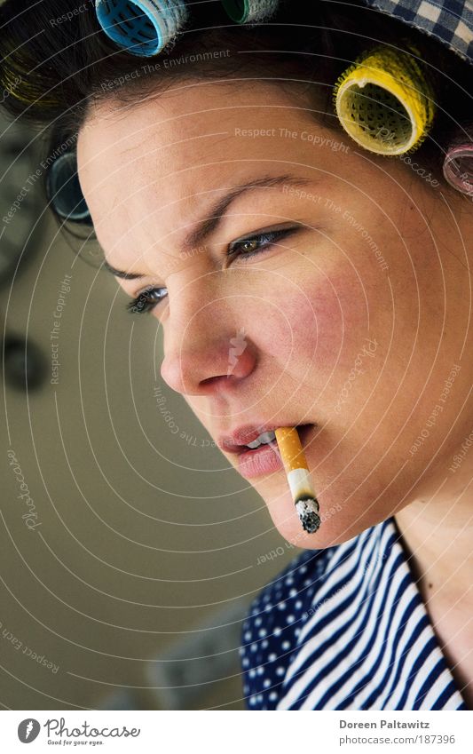 Smoking woman with curlers in her hair - a Royalty Free Stock Photo from  Photocase