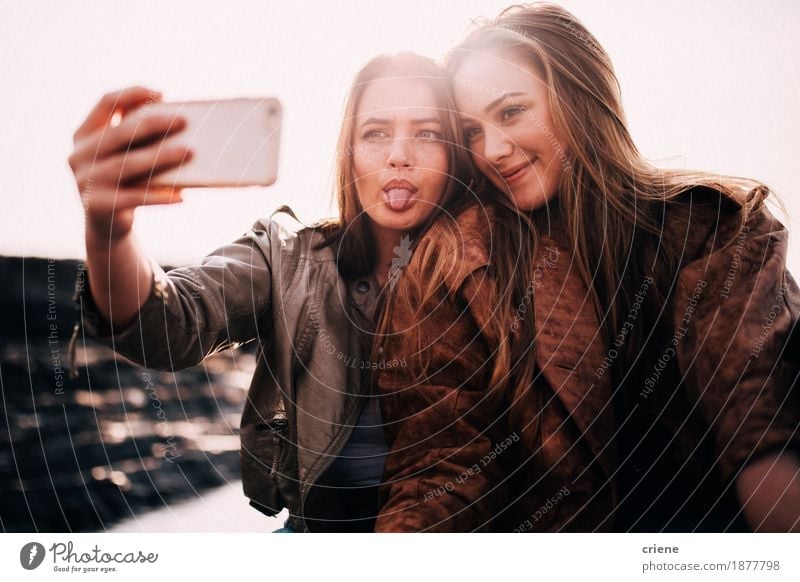 Teenager Best friends taking selfie with smart phone Lifestyle Joy Vacation & Travel Telephone Camera Technology Young woman Youth (Young adults) Friendship