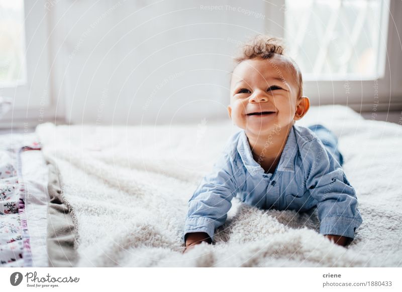 Cute adorable toddler smiling while laying on bed at home Lifestyle Joy Body Face Parenting Child Human being Baby Toddler Infancy 0 - 12 months Smiling