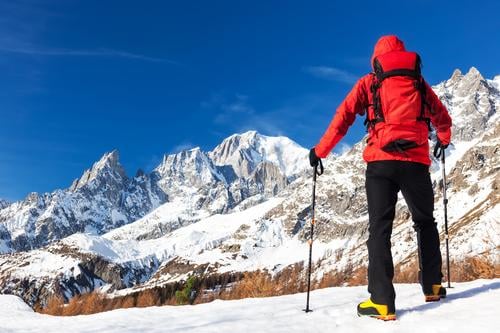 Hiker takes a rest looking at Mont Blanc, Courmayer, Italy. Beautiful Vacation & Travel Tourism Trip Adventure Expedition Winter Snow Mountain Hiking Sports