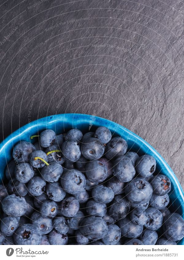 Delicious blueberries Fruit Nutrition Organic produce Vegetarian diet Summer Fresh Healthy Blue Background picture black food rustic sweet berry natural bowl