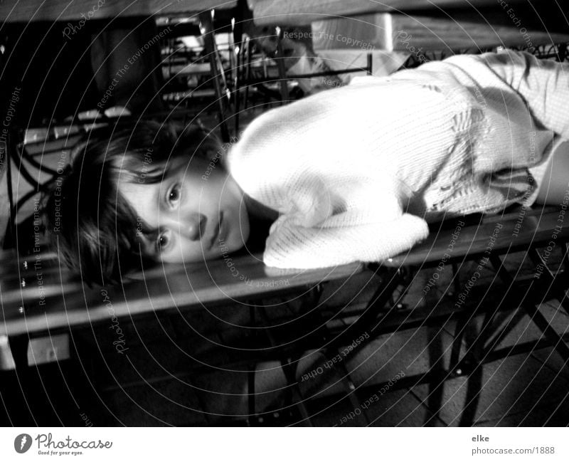 dreaming Child Girl Night Sweater Lie Fatigue Bench Black & white photo Looking into the camera Exterior shot Calm Break