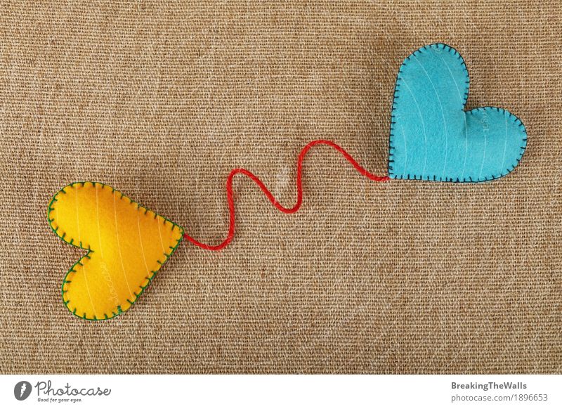 Two handmade felt craft hearts yellow and blue on canvas Leisure and hobbies Handicraft Handcrafts Valentine's Day Wedding Art Cloth Heart Love Together Natural