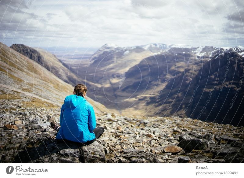 Woman sitting on a rock overlooking the Glencoe Valley, Scotland Lunch Vacation & Travel Adults Nature Fitness Adventure Relaxation Experience