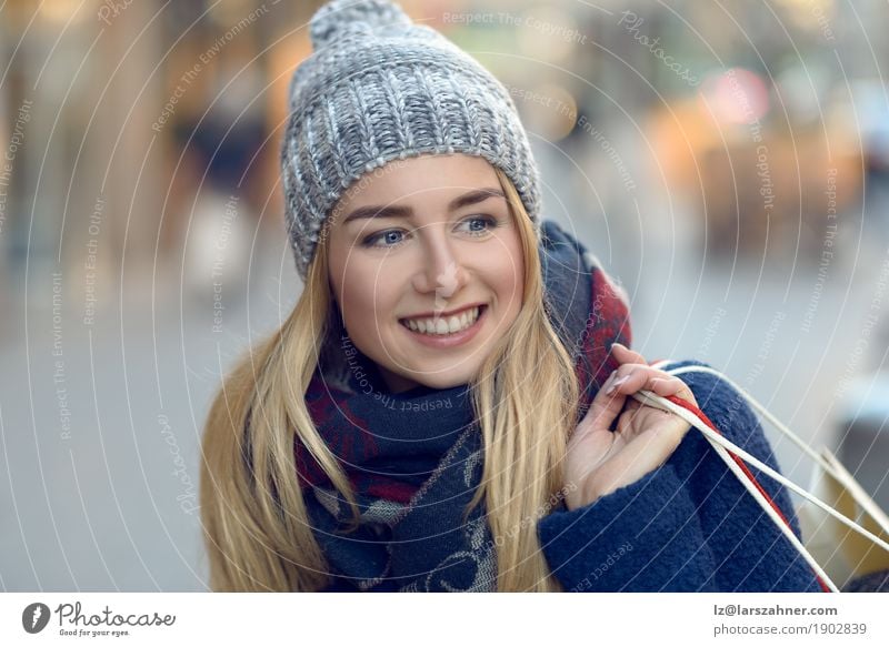 Gorgeous young woman out shopping Shopping Happy Beautiful Face Winter Woman Adults 1 Human being 18 - 30 years Youth (Young adults) Pedestrian Street Fashion