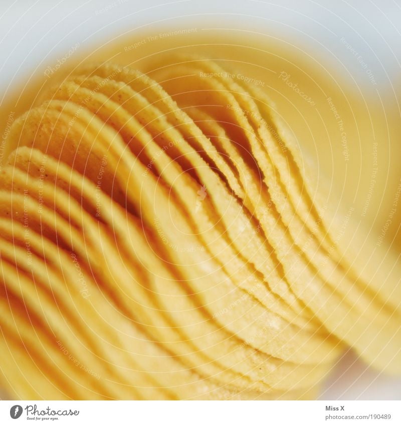 chips Food Dough Baked goods Nutrition Fast food Overweight Round Crisps Salty Potatoes Appetite Unhealthy Yellow Colour photo Interior shot Studio shot