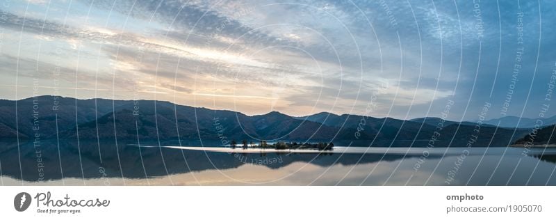 Wide panoramic landscape of a mountain lake with small island in the middle Island Winter Mountain Nature Landscape Water Sky Clouds Sunrise Sunset Autumn Tree