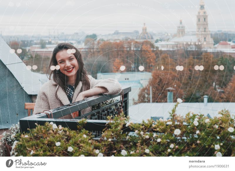 Happy girl on the balcony Lifestyle Young woman Youth (Young adults) Woman Adults Tree Flower Blossom Small Town Balcony Terrace Roof Cool (slang) Good Emotions