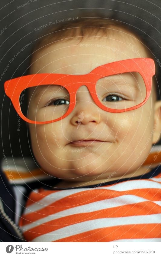 boy smiling and looking up with carboard glasses Lifestyle Style Joy Beautiful Feasts & Celebrations Carnival Hallowe'en Fairs & Carnivals Birthday Parenting