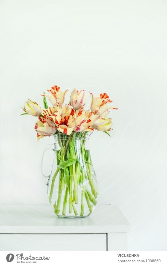 Beautiful tulips in glass vase on white table Style Design Living or residing Flat (apartment) Interior design Decoration Nature Spring Flower Tulip