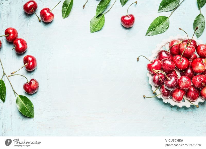 Cherries in the bowl with twigs and leaves Food Fruit Nutrition Organic produce Lifestyle Style Design Healthy Healthy Eating Summer Table Cherry