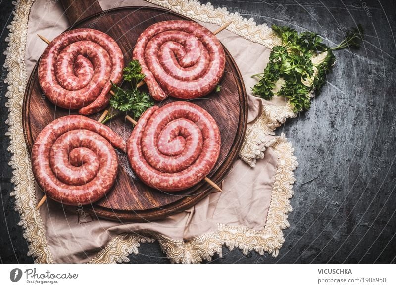 Bratwurst snails on cutting board Food Meat Sausage Nutrition Picnic Style Kitchen Barbecue (apparatus) Design Raw Chopping board Rustic Food photograph BBQ