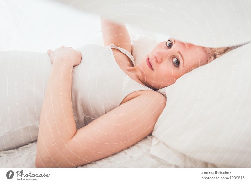 under the ceiling Feminine Young woman Youth (Young adults) Life 1 Human being 18 - 30 years Adults T-shirt Cloth Blonde Think Relaxation Lie Looking Sadness
