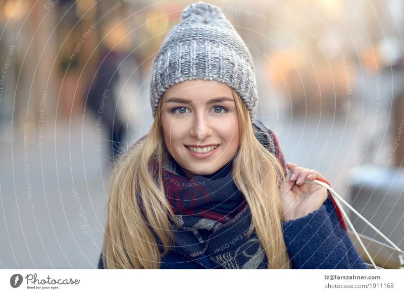 Gorgeous young woman out shopping Shopping Happy Beautiful Face Winter Woman Adults 1 Human being 18 - 30 years Youth (Young adults) Pedestrian Street Fashion