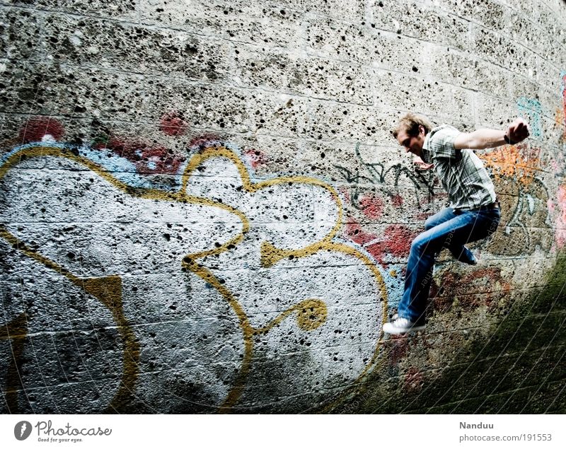 hop Human being Masculine 1 18 - 30 years Youth (Young adults) Adults Jump Wall (building) Wall (barrier) Graffiti Gray Town Colour photo Subdued colour