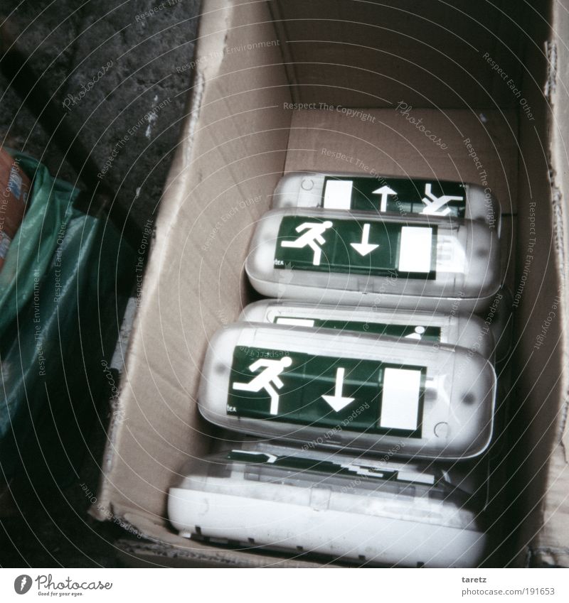 One forward, two back. Sign Signs and labeling Arrow Fear Emergency exit Panic Escape Symbols and metaphors Conflicting Cardboard Trend-setting Chaos
