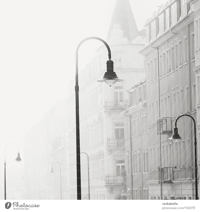 Row of houses with street lamps Flat (apartment) Dresden Town House (Residential Structure) Esthetic Threat Dirty Dark Elegant Cold Gray Emotions Trust Safety