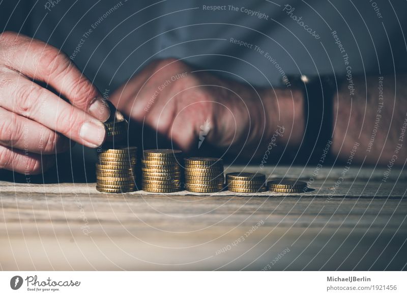 Man stacks money coins, growth or savings Business Success Human being Masculine Adults Hand 1 45 - 60 years Advancement Businessman Investor investment Growth