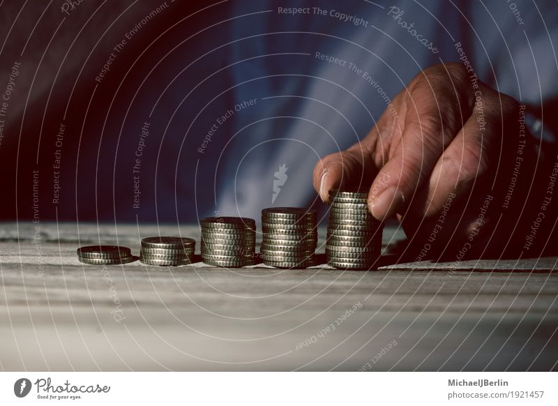 Hand with growing money stacks Business Human being Masculine 1 Advancement Money Growth Save investment yield Colour photo Close-up Detail Copy Space bottom