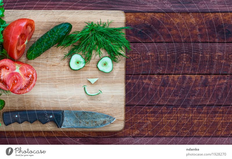 smiley face made of pieces of fresh vegetables Vegetable Herbs and spices Vegetarian diet Knives Wood Diet Eating Fresh Delicious Funny Cute Brown Green Red