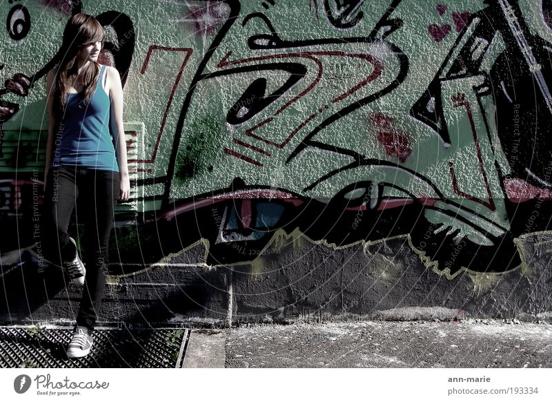 standing at the wall ... waiting Wall (barrier) Wall (building) Brunette Graffiti Touch Cool (slang) Multicoloured Exterior shot Copy Space right Looking away
