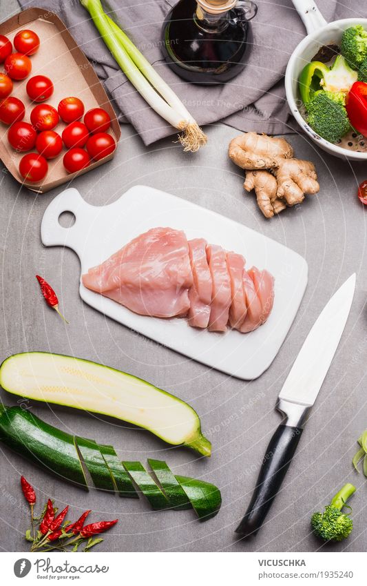 Cut raw chicken breast fillet on white chopping board Food Meat Vegetable Herbs and spices Cooking oil Nutrition Lunch Dinner Organic produce Diet Slow food