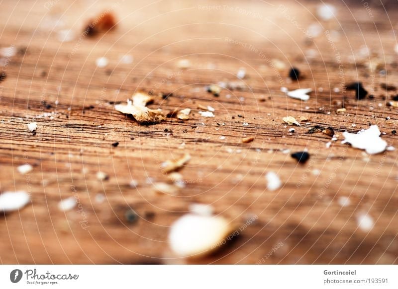 fullness Crumbs Wooden board Chopping board Breadcrumbs Dry Brown Remainder Colour photo Subdued colour Close-up Detail Macro (Extreme close-up)