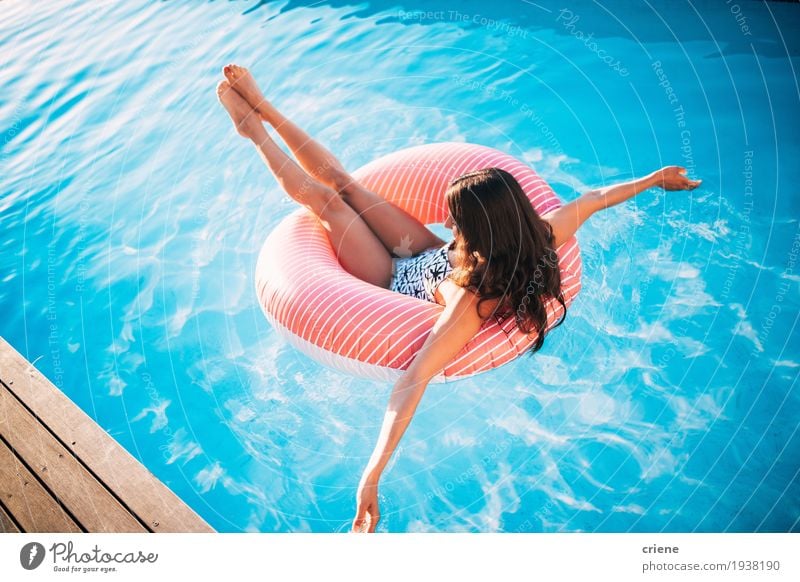Attractive young women relaxing in swiming pool. Lifestyle Joy Beautiful Well-being Relaxation Swimming pool Leisure and hobbies Vacation & Travel Summer