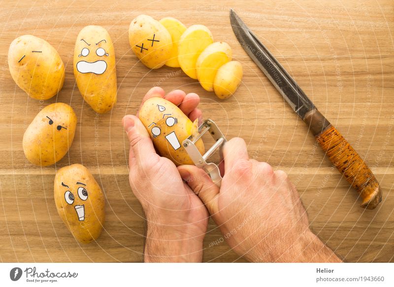 Potatoes in panic fear Vegetable Nutrition Knives Chopping board peeler Hand Wood Metal Creepy Brown Black White Emotions Pain Fear Horror Fear of death