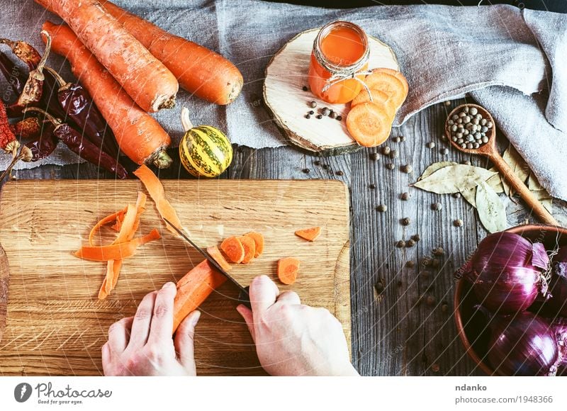 Two female hands chopped fresh carrot slices Vegetable Herbs and spices Nutrition Eating Vegetarian diet Diet Beverage Juice Knives Body Table Young woman