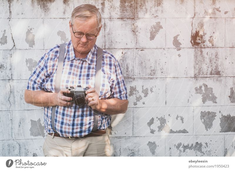 older hipster man with a old vintage camera Lifestyle Style Design Joy Save Human being Father Adults 1 Art Artist Adventure Colour photo Multicoloured Close-up