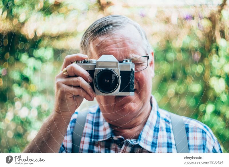 older hipster man with a old vintage camera Lifestyle Style Joy Happy Human being Father Adults 1 Art Artist Adventure Colour photo Close-up Detail