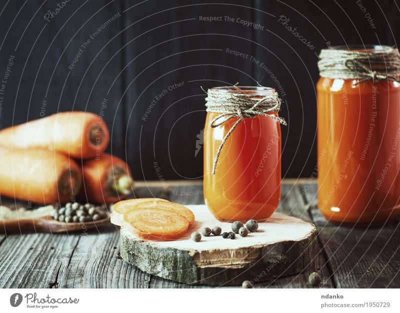 Two glass jars with fresh carrot juice Vegetable Dessert Herbs and spices Eating Breakfast Vegetarian diet Diet Beverage Juice Bottle Spoon Table Kitchen