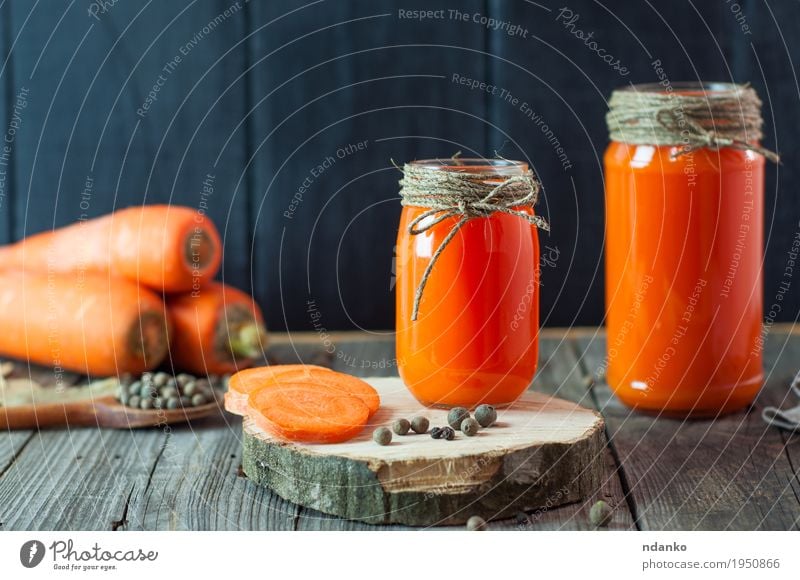 Two glass jars with fresh carrot juice Vegetable Dessert Herbs and spices Eating Breakfast Vegetarian diet Diet Juice Bottle Spoon Table Kitchen Restaurant