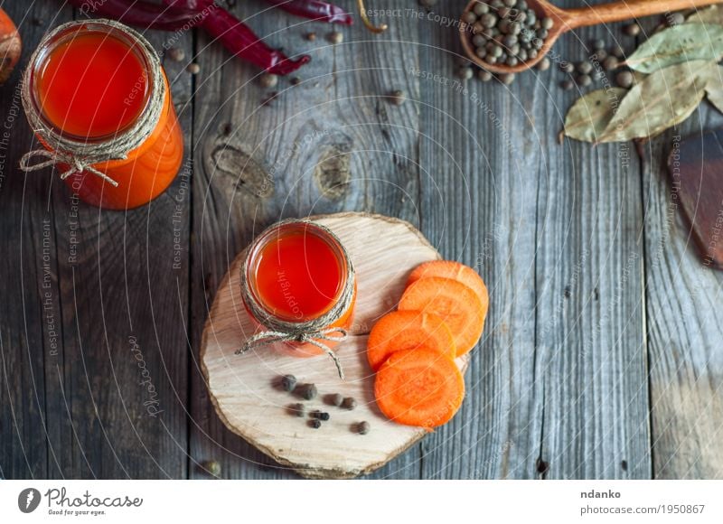 Fresh carrot juice in glass jars, top view Vegetable Herbs and spices Eating Breakfast Drinking Juice Cup Spoon Table Kitchen Container Healthy Bright Above
