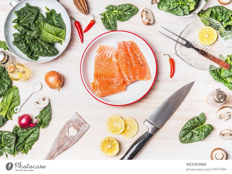 Salmon with spinach on a white kitchen table Food Fish Vegetable Herbs and spices Cooking oil Nutrition Lunch Dinner Organic produce Vegetarian diet Diet