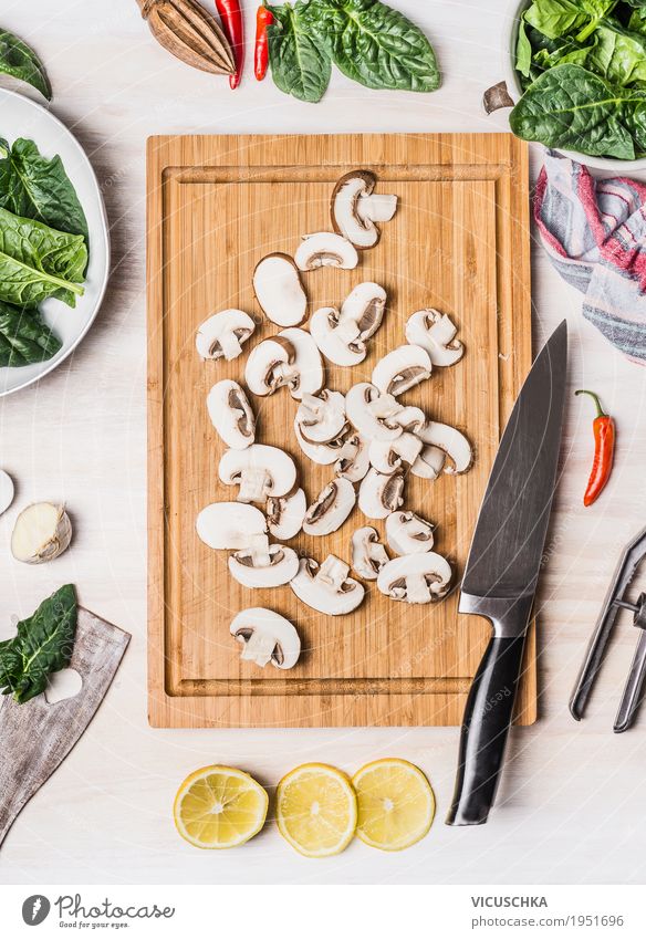 Sliced mushrooms on cutting board with kitchen knife Food Vegetable Nutrition Organic produce Vegetarian diet Diet Crockery Knives Style Design Healthy