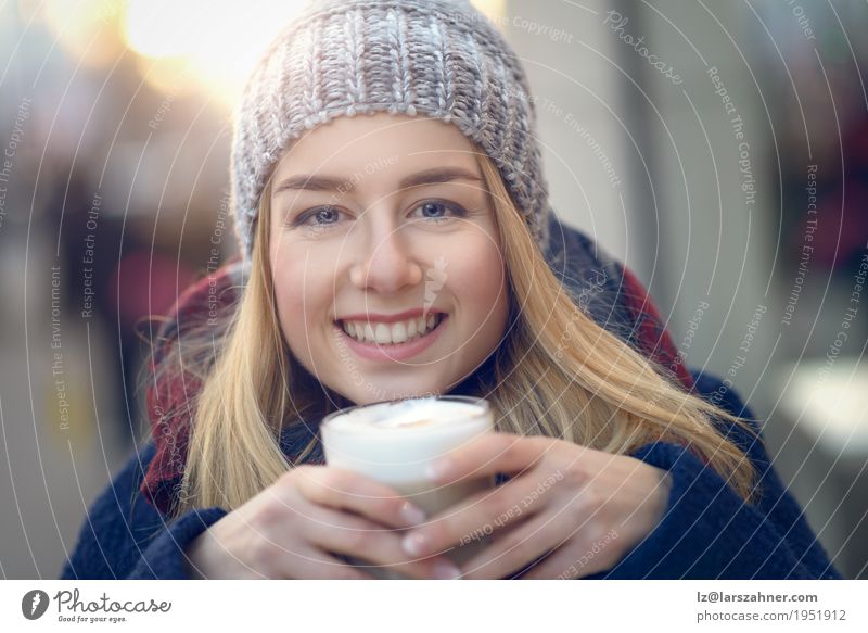 Young blond woman drinking big glass of coffee Nutrition Drinking Coffee Latte macchiato Lifestyle Happy Beautiful Face Winter Woman Adults 1 Human being