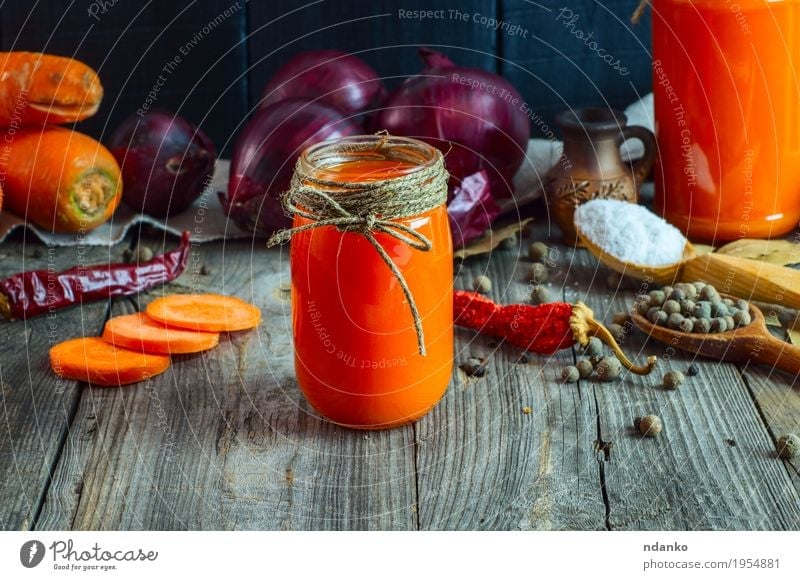 jars of fresh carrot juice Vegetable Herbs and spices Nutrition Vegetarian diet Beverage Cold drink Juice Table Financial institution Rope Diet Eating Fresh