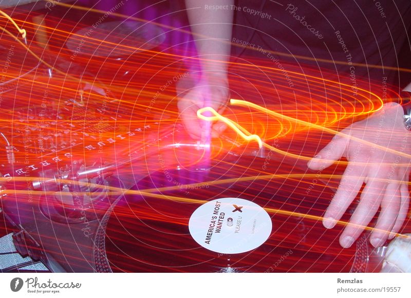 Amarican´s most wanted? Disc jockey Hand Turntable Light Long exposure Human being Music