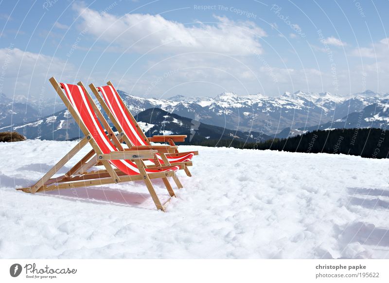 Sun loungers in the snow in front of mountain panorama Relaxation Vacation & Travel Sunbathing Winter Snow Winter vacation Mountain Ski resort Beautiful weather