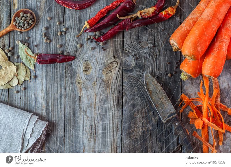 Carrot, chili and spices on gray wooden surface Food Vegetable Herbs and spices Nutrition Eating Vegetarian diet Knives Spoon Table Old Fresh Natural Gray