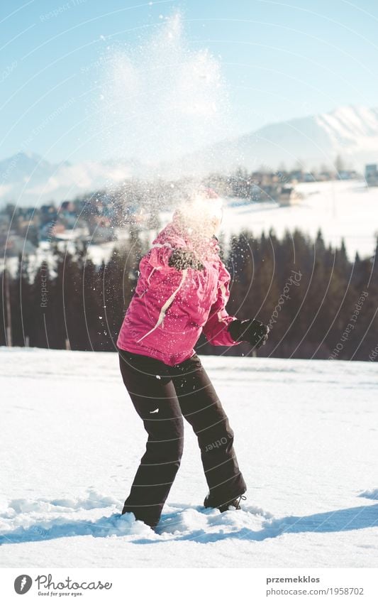 Woman throwing the snow in the air Lifestyle Vacation & Travel Trip Winter Snow Winter vacation Adults 1 Human being 30 - 45 years Nature Hill Mountain To enjoy