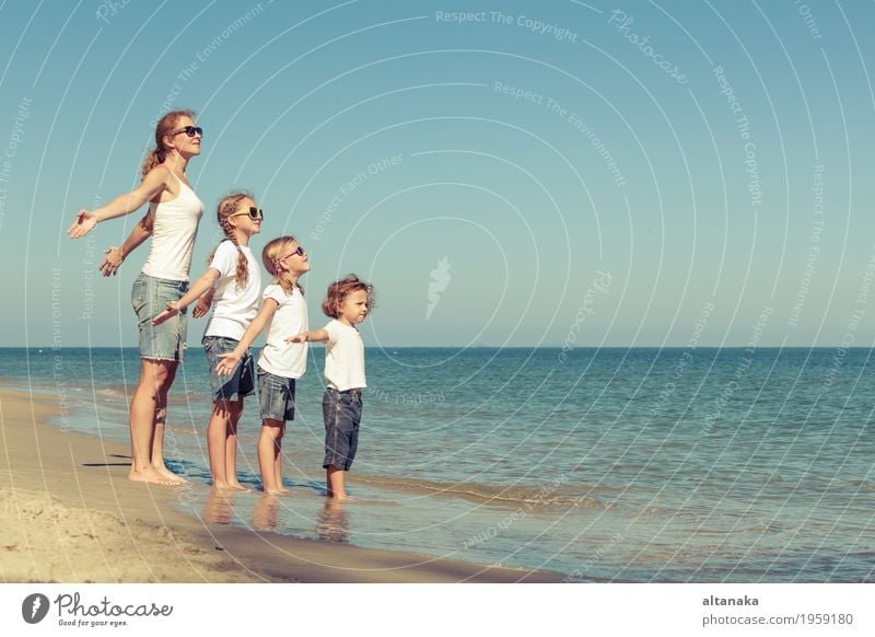 Mother and children playing on the beach. Lifestyle Joy Relaxation Leisure and hobbies Playing Vacation & Travel Trip Freedom Summer Sun Beach Ocean Child
